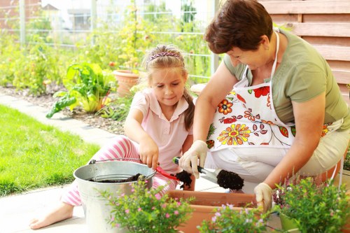 Insured gardeners carrying out careful outdoor work