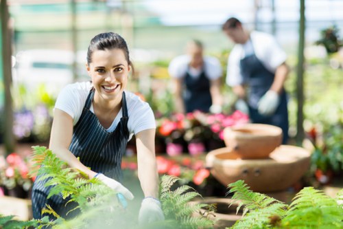 Professional gardeners managing a planned outdoor service visit